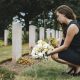 Insight Legal Solutions: young woman lays flowers at grave while preparing to take on the role of Executor for the Estate